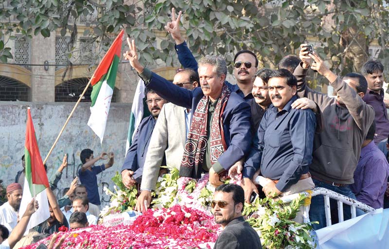 in this file photo karachi mayor wasim akhtar and hyderabad mayor tayyab hussain are being welcomed by the muttahida qaumi movement workers in hyderabad photo online