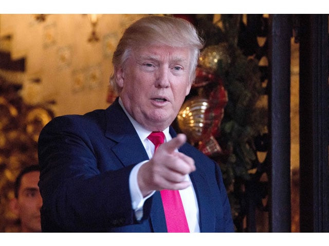 us president elect donald trump speaks to reporters at mar a lago in palm beach florida where he is taking meetings on december 21 2016 photo afp