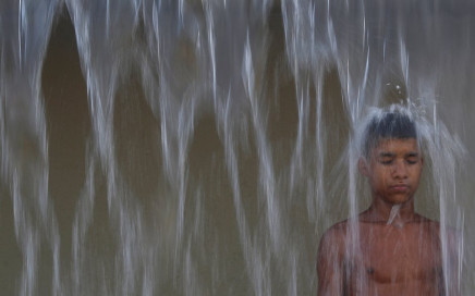 a child plays with water in madureira park on the first day of summer in rio de janeiro brazil photo reuters