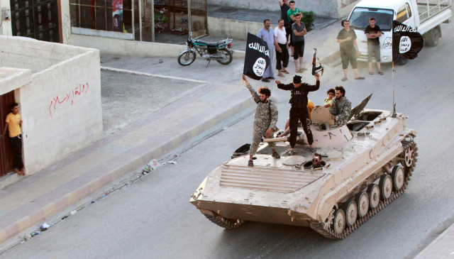 militants fighters take part in a military parade along the streets of northern raqqa province photo reuters militants fighters take part in a military parade along the streets of northern raqqa province photo reuters