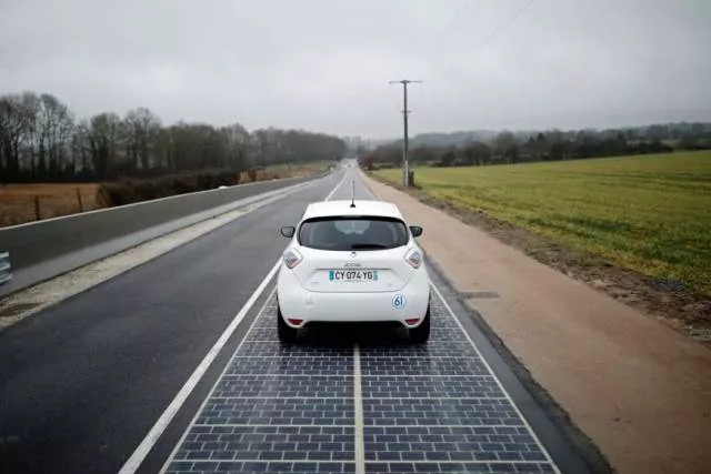 an automobile drives on a solar road during its inauguration in tourouvre france on thursday photo reuters an automobile drives on a solar road during its inauguration in tourouvre france on thursday photo reuters