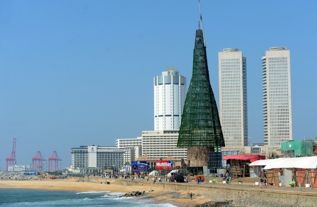 residents walk past a partially constructed christmas tree in colombo photo afp