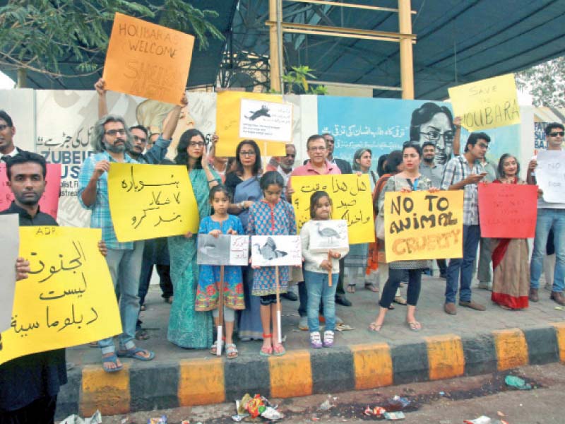 concerned citizens including children held a protest on saturday to decry barbaric treatment of endangered species photo athar khan express