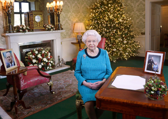 britain 039 s queen elizabeth ii sits at a desk in the regency room in buckingham palace in london after recording her christmas day broadcast to the commonwealth on december 25 2016 photo afp