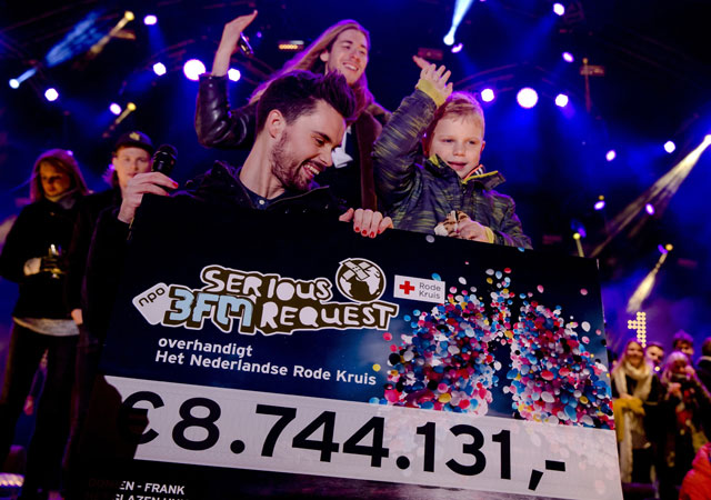 dutch 3fm dj 039 s domien verschuuren l and frank van der lende show together with 6 year old tijn kolsteren the amount of money 8 744 131 euros they have raised at the house of glass het glazen huis of serious request in breda photo afp