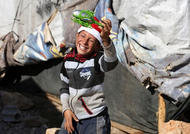 a syrian refugee child plays with his christmas gift from sawa a non governmental organisation in bar elias in the bekaa valley photo reuters a syrian refugee child plays with his christmas gift from sawa a non governmental organisation in bar elias in the bekaa valley photo reuters