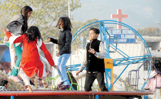 children play on a trampoline on christmas photo online