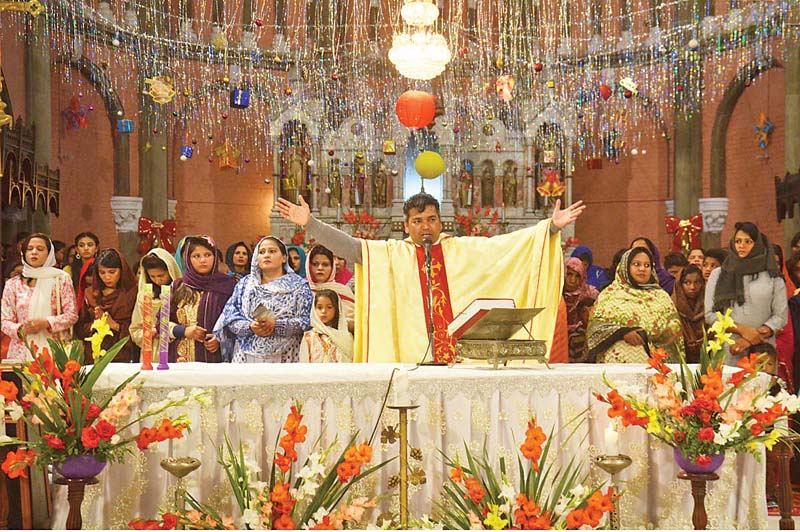 father at st anthony s church in lahore leads the mass with the christian community members photo online