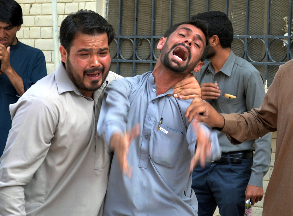 relatives mourn outisde quetta hopsital photo afp