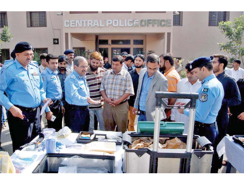 ig tariq masood yasin briefs media persons about the forensic equipment of the homicide unit photo app