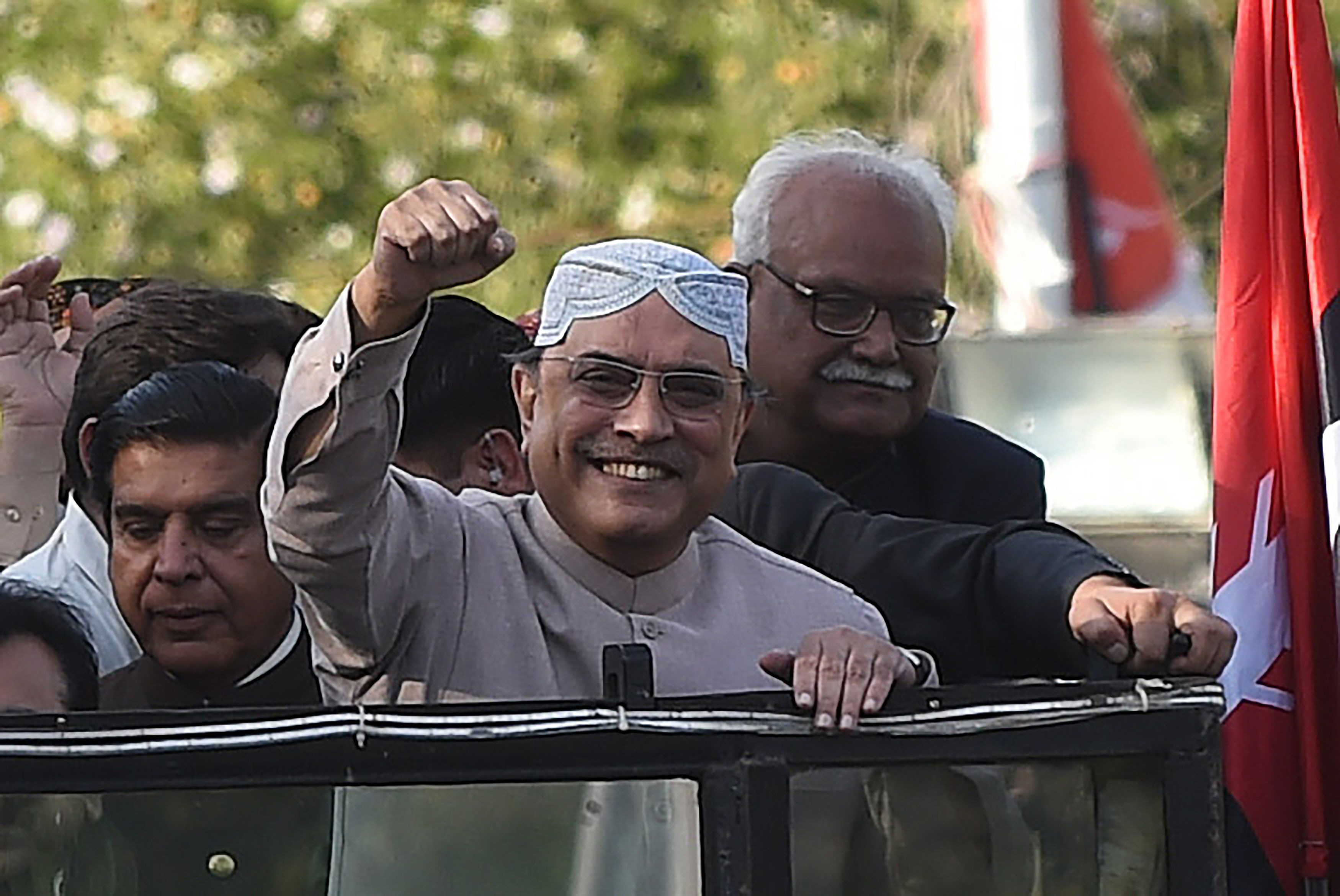 pakistan peoples party co chairman asif zardari gestures to supporters after he returns to karachi photo reuters