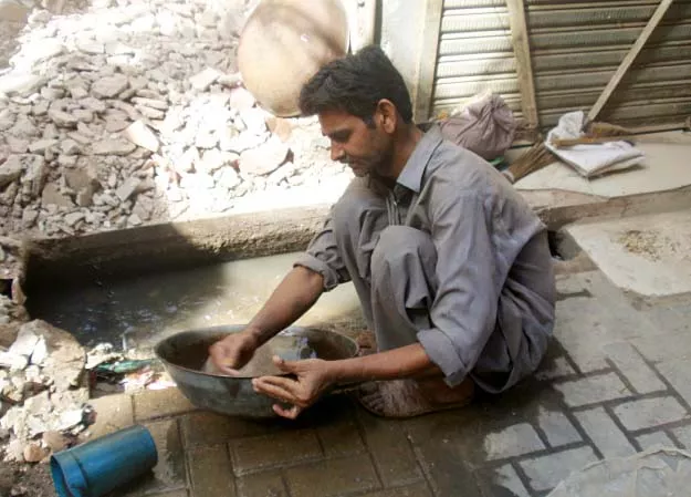 a gold miner from sarrafa bazaar a gold miner from sarrafa bazaar