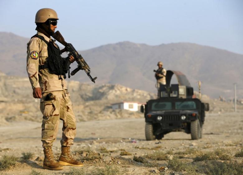 afghan policemen stand guard at a checkpoint in the deh sabz district of kabul afghanistan photo reuters