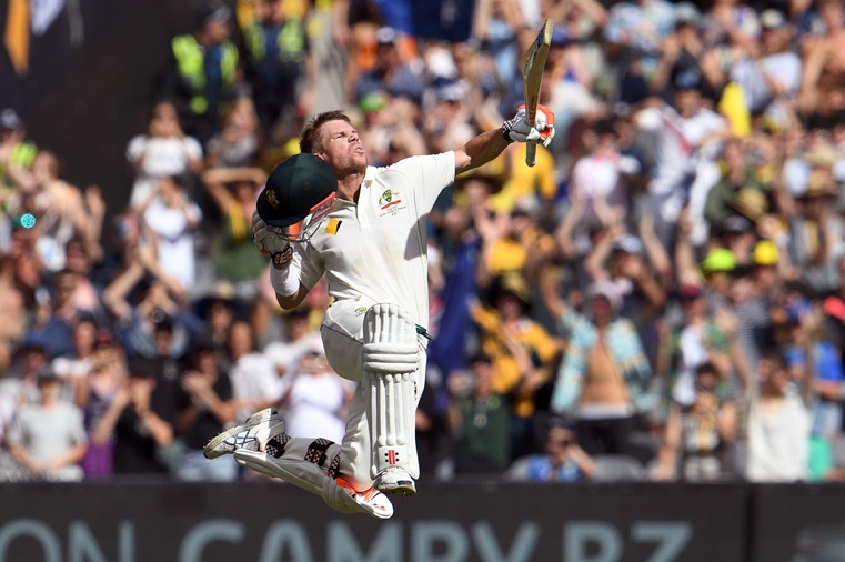 australian batsman david warner leaps in the air as he celebrates his century against pakistan on the third day of the second cricket test match in melbourne on december 28 2016 photo afp