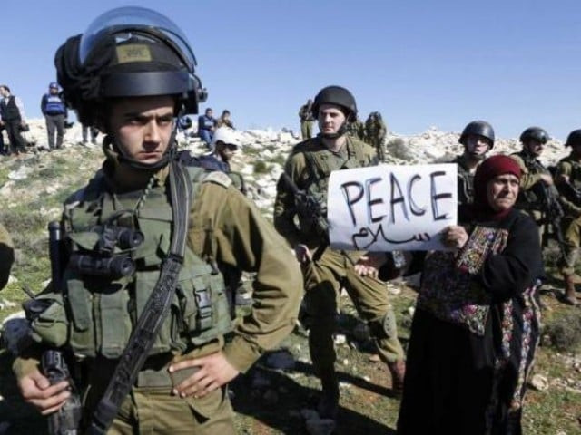 a palestinian protesting for peace next to israeli soldiers photo reuters a palestinian protesting for peace next to israeli soldiers photo reuters
