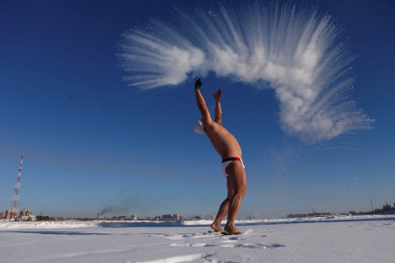 a man throws hot water into cold air in heihe heilongjiang province china photo reuters