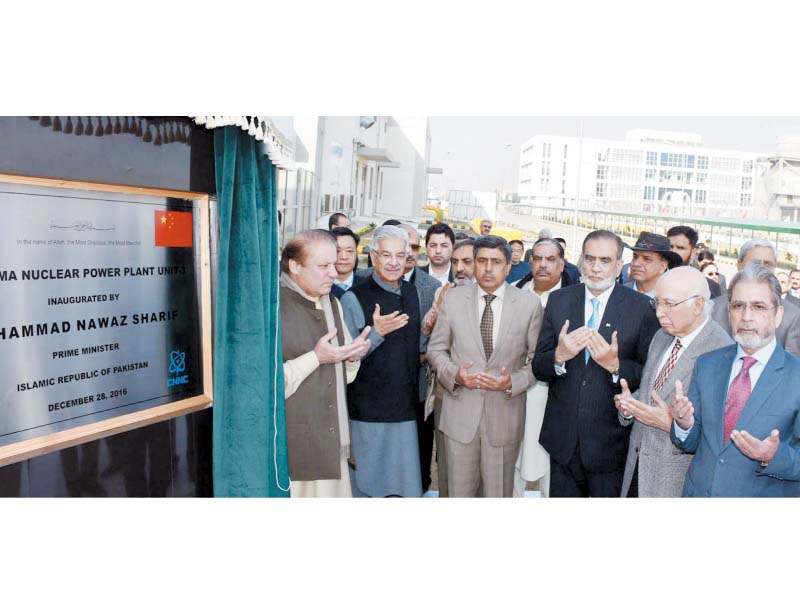 pm nawaz and other senior govt figures pray at the inauguration of chashma nuclear power plant iii photo ppi