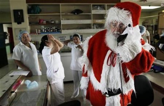 einar sveinsson of iceland dressed as santa claus talks on a telephone during his visit at the benjamin bloom national children hospital in san salvador december 17 2009 reuters luis galdamez einar sveinsson of iceland dressed as santa claus talks on a telephone during his visit at the benjamin bloom national children hospital in san salvador december 17 2009 reuters luis galdamez