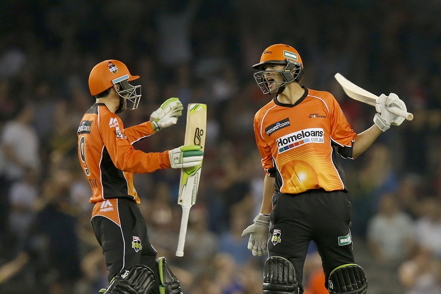 ashton agar celebrates with team mate sam whitman of the perth scorchers after hitting a six on the final ball to win the bbl match against the melbourne renegades at etihad stadium on december 29 2016 in melbourne photo courtesy cricket australia