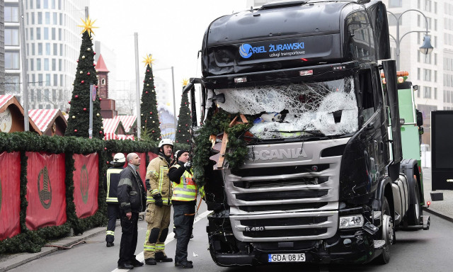 firefighters inspect the truck that crashed into a christmas market in berlin twelve people died in the attack photo afp firefighters inspect the truck that crashed into a christmas market in berlin twelve people died in the attack photo afp