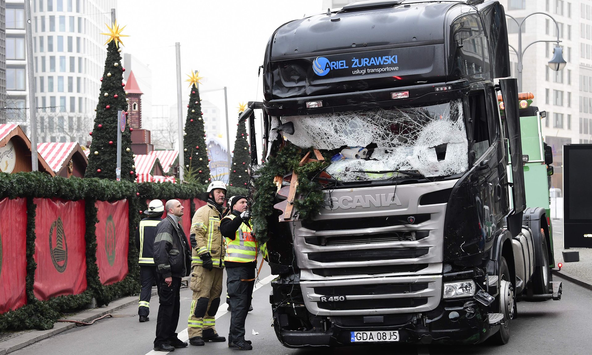 firefighters inspect the truck that crashed into a christmas market in berlin twelve people died in the attack photo afp