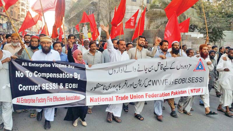 the families of the victims are dissatisfied with the decision to have the workers social security and pension institutions distribute the compensation funds instead of the sindh high court photo express