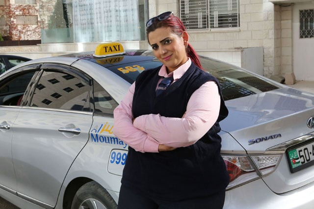 jordanian female taxi driver nisrin akoubeh poses for a photograph on december 6 2016 in amman the red haired mother of three works a gruelling 10 hour shift in her taxi a rare occupation for a woman in this conservative muslim society photo afp jordanian female taxi driver nisrin akoubeh poses for a photograph on december 6 2016 in amman the red haired mother of three works a gruelling 10 hour shift in her taxi a rare occupation for a woman in this conservative muslim society photo afp