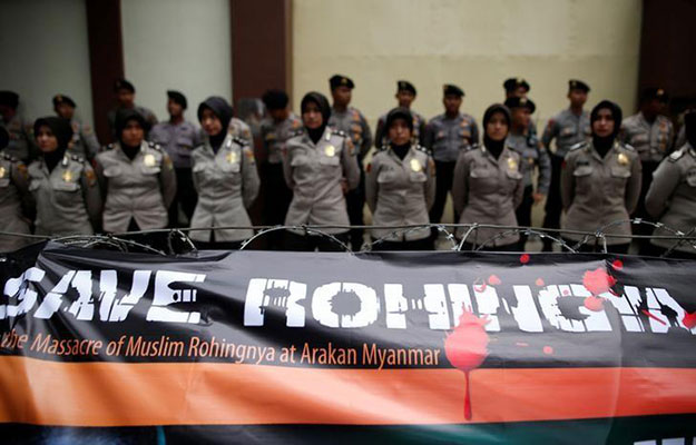 a banner is tied to barbed wire outside the myanmar embassy during a protest against what organisers say is the crackdown on ethnic rohingya muslims in myanmar in jakarta indonesia november 25 2016 photo reuters