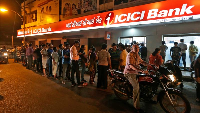 queues built up outside banks and cash machines photo reuters