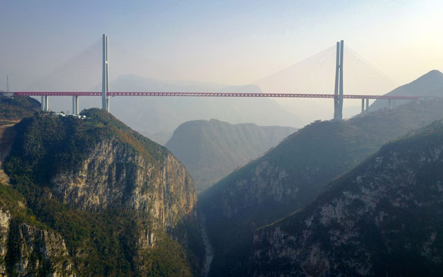 this picture taken on december 28 2016 shows the beipanjiang bridge near bijie in southwest china 039 s guizhou province the world 039 s highest bridge has opened to traffic in china connecting two southwestern provinces and reducing travel time by three quarters local authorities said on december 30 photo afp