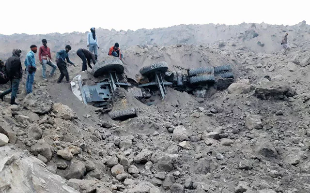 people gather near the site of a coal mine collapse near lalmatia in godda district in eastern jharkhand state on december 30 2016 at least five workers were killed and scores more feared trapped on december 30 after a massive mound of earth caved in at a coal mine in eastern india photo afp people gather near the site of a coal mine collapse near lalmatia in godda district in eastern jharkhand state on december 30 2016 at least five workers were killed and scores more feared trapped on december 30 after a massive mound of earth caved in at a coal mine in eastern india photo afp
