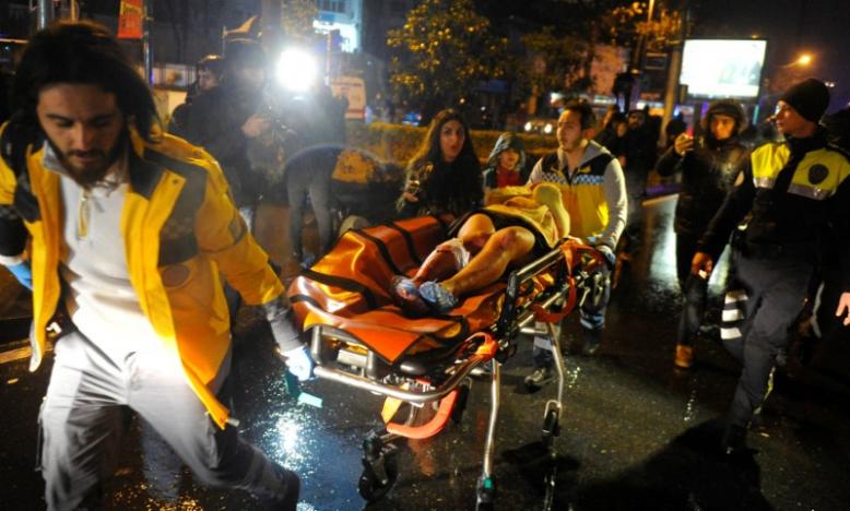 an injured woman is carried to an ambulance from a nightclub where a gun attack took place during a new year party in istanbul turkey january 1 2017 photo reuters