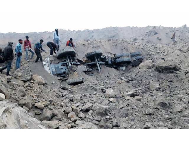 people gather near the site of a coal mine collapse near lalmatia in godda district in eastern jharkhand state on december 30 2016 photo afp