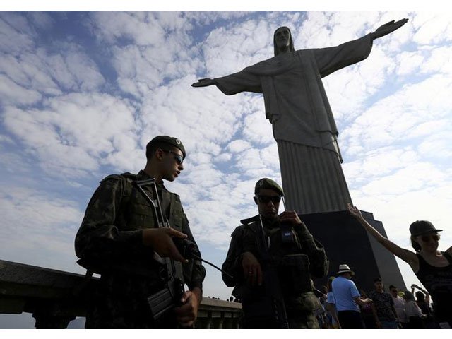 brazilian security forces stand guard under the christ the redeemer statue in rio de janeiro brazil august 6 2016 photo reuters