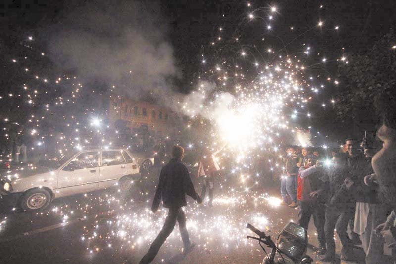 people set off firecrackers to celebrate new year in lahore photo abid nawaz express