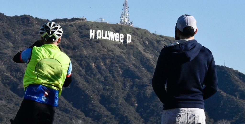 the famous hollywood sign reads quot hollyweed quot after it was vandalized january 1 2017 photo afp