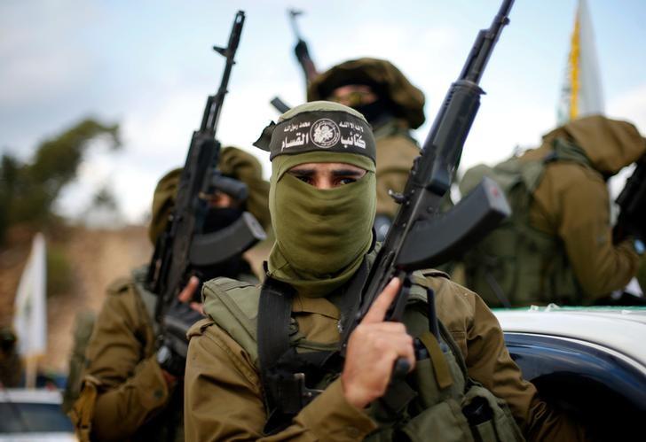 hamas marches during a military parade marking the 29th anniversary of the founding of the hamas movement photo reuters