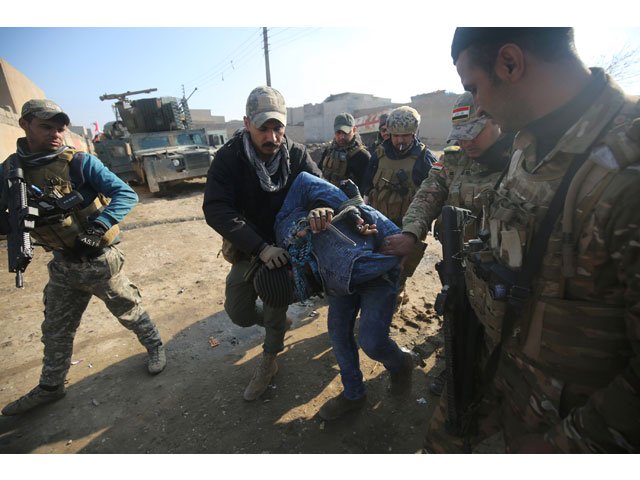 iraqi forces detain a man suspected of belonging to the islamic state is group in the al intisar area in eastern mosul after recapturing it in an ongoing military operation against the militants on january 1 2017 photo afp