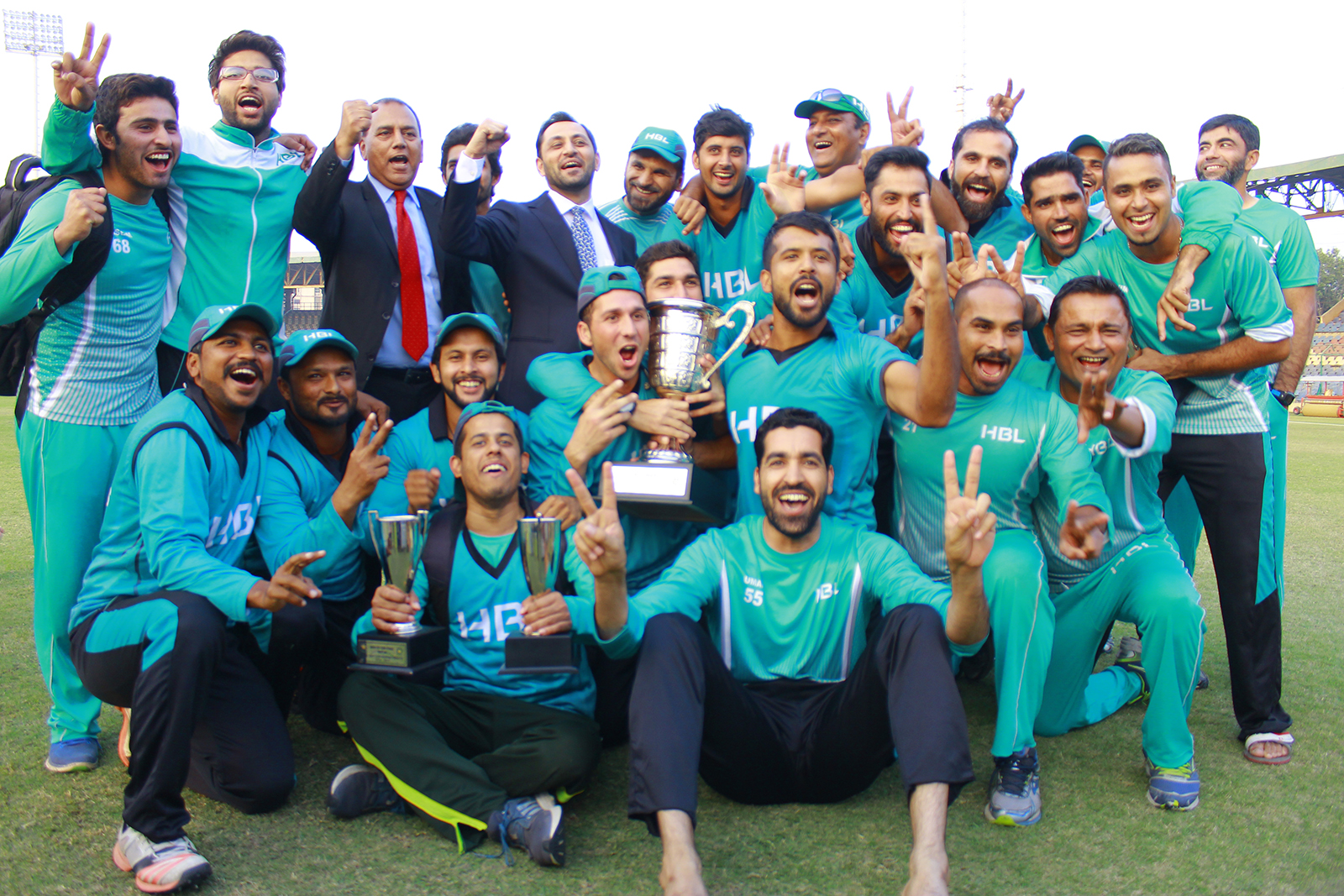 top of the world delighted hbl players pose with the silverware after claiming the national one day cup trophy for departments photo courtesy pcb