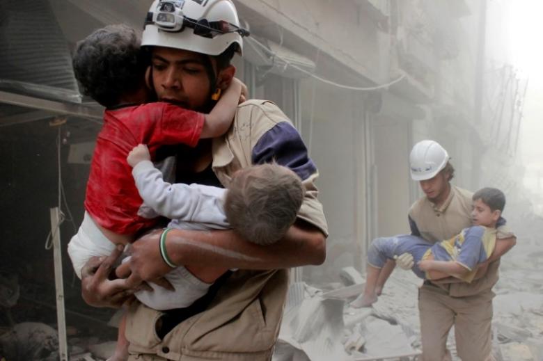 members of the civil defence rescue children after what activists said was an air strike by forces loyal to syria 039 s president bashar al assad in al shaar neighbourhood of aleppo syria june 2 2014 reuters sultan kitaz file photo