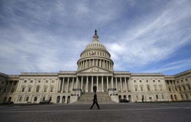 a lone worker passes by the us capitol building in washington photo reuters