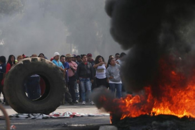 protesters block the entrance to a pemex gas station as they burn tires during a protest against the rising prices of gasoline enforced by the mexican government in san miguel totolcingo mexico january 3 2017 photo reuters protesters block the entrance to a pemex gas station as they burn tires during a protest against the rising prices of gasoline enforced by the mexican government in san miguel totolcingo mexico january 3 2017 photo reuters