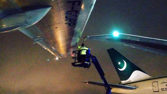 an airport worker attends to a damaged wing after a pakistan international airlines plane clipped an air france plane at pearson international airport on jan 3 2017 photo twitter jetstreamphotog an airport worker attends to a damaged wing after a pakistan international airlines plane clipped an air france plane at pearson international airport on jan 3 2017 photo twitter jetstreamphotog