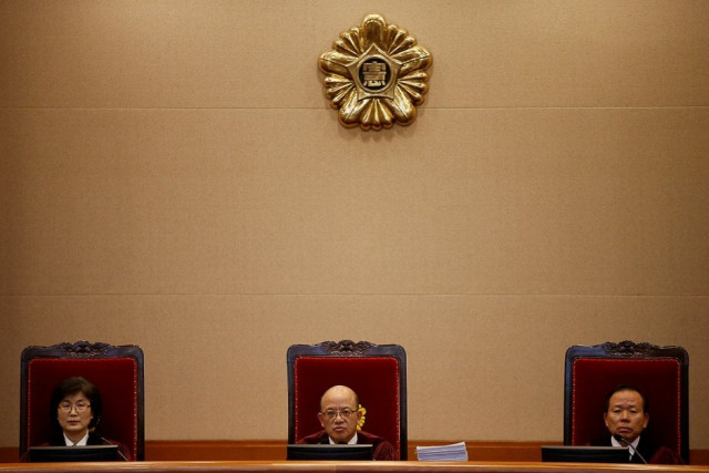chief justice park han chul c presides over the first hearing arguments for south korean president park geun hye 039 s impeachment trial at the constitutional court in seoul south korea photo reuters
