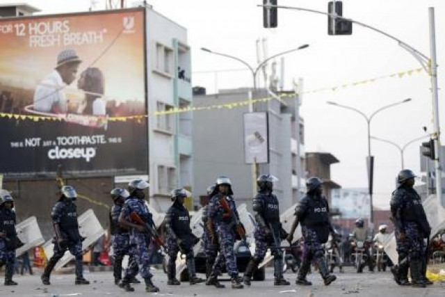 riot police block a street as police and military forces disperse a procession by uganda 039 s leading opposition party forum for democratic change supporters with their presidential candidate to a campaign ground in kampala uganda photo reuters riot police block a street as police and military forces disperse a procession by uganda 039 s leading opposition party forum for democratic change supporters with their presidential candidate to a campaign ground in kampala uganda photo reuters
