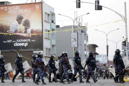 riot police block a street as police and military forces disperse a procession by uganda 039 s leading opposition party forum for democratic change supporters with their presidential candidate to a campaign ground in kampala uganda photo reuters