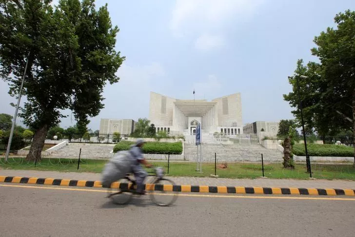 a man rides a bicycle past the supreme court building in islamabad pakistan photo reuters a man rides a bicycle past the supreme court building in islamabad pakistan photo reuters