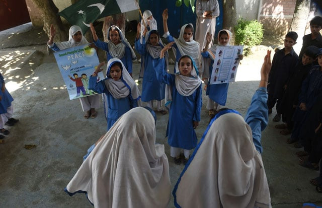in this photograph taken on august 30 2016 hindko speaking schoolchildren sing the national anthem at their school in mansehra around a hundred women have gathered in a community centre in peshawar the heart of pakistan 039 s fabled northwest but they are conversing in a dialect incomprehensible to the pashtun ethnic group that dominates the region photo afp in this photograph taken on august 30 2016 hindko speaking schoolchildren sing the national anthem at their school in mansehra around a hundred women have gathered in a community centre in peshawar the heart of pakistan 039 s fabled northwest but they are conversing in a dialect incomprehensible to the pashtun ethnic group that dominates the region photo afp
