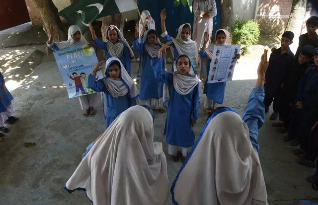 in this photograph taken on august 30 2016 hindko speaking schoolchildren sing the national anthem at their school in mansehra around a hundred women have gathered in a community centre in peshawar the heart of pakistan 039 s fabled northwest but they are conversing in a dialect incomprehensible to the pashtun ethnic group that dominates the region photo afp in this photograph taken on august 30 2016 hindko speaking schoolchildren sing the national anthem at their school in mansehra around a hundred women have gathered in a community centre in peshawar the heart of pakistan 039 s fabled northwest but they are conversing in a dialect incomprehensible to the pashtun ethnic group that dominates the region photo afp