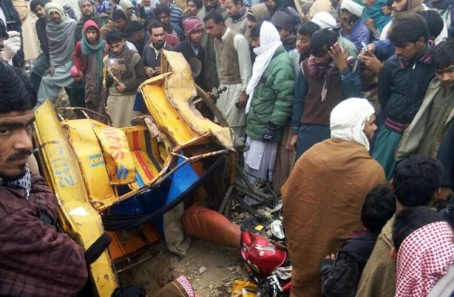 people gather around the damaged rickshaw which was hit by hazara express on january 6 2017 photo online people gather around the damaged rickshaw which was hit by hazara express on january 6 2017 photo online